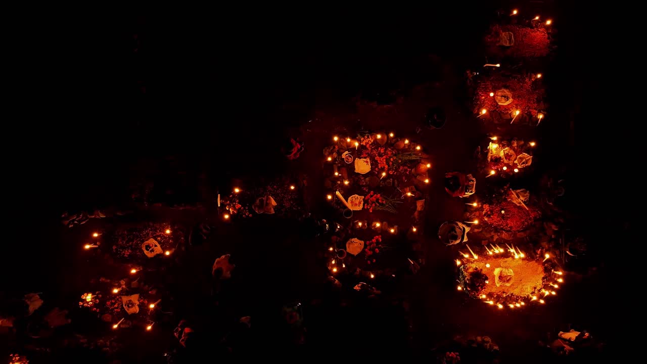 DRONE: TOP DOWN VIEW OF TOMBS AT A GRAVEYARD AT PACANDA ISLAND IN PATZCUARO MICHOACAN