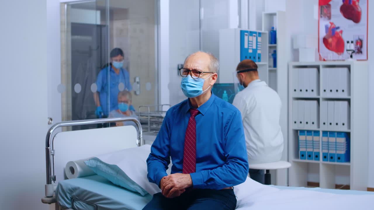 Old man wearing mask at doctor appointment