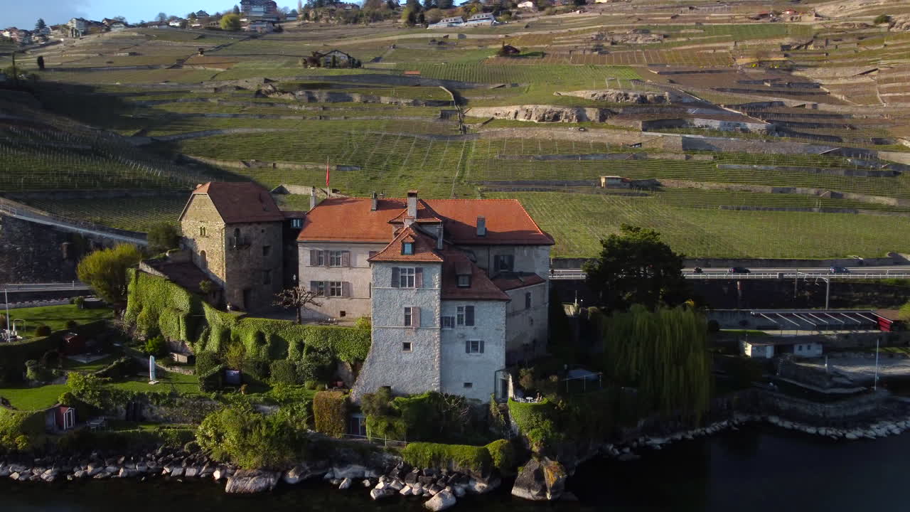 Drone fly around the castlle of Rivaz and reveal the lake Léman, Vevey, Montreux, in Switzerland
