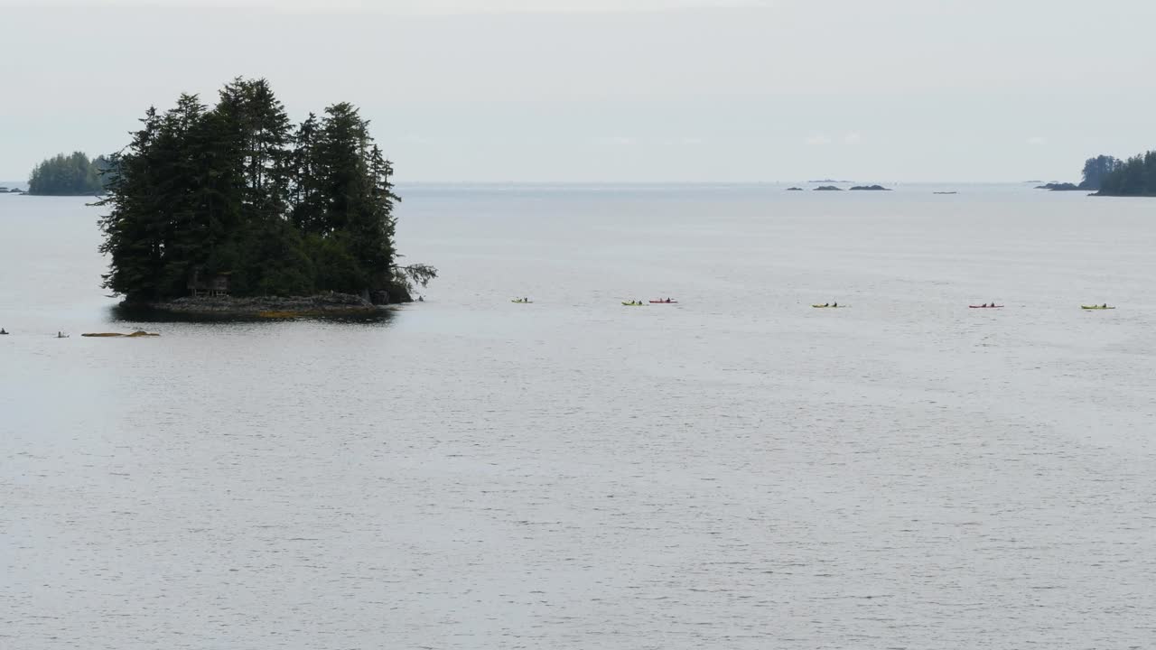 Group of tourists sea kayaking in Sitka, Alaska, Cove Marina.Outdoors activity in vacation.