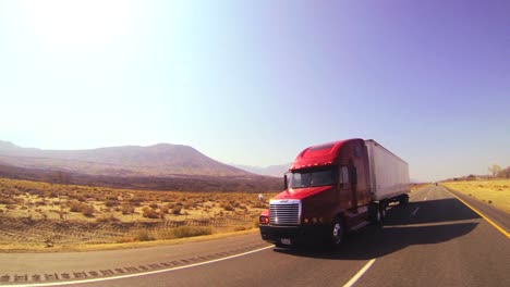 An-18-wheeler-truck-moves-across-the-desert-in-this-POV-shot