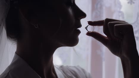 a bride holding her wedding ring