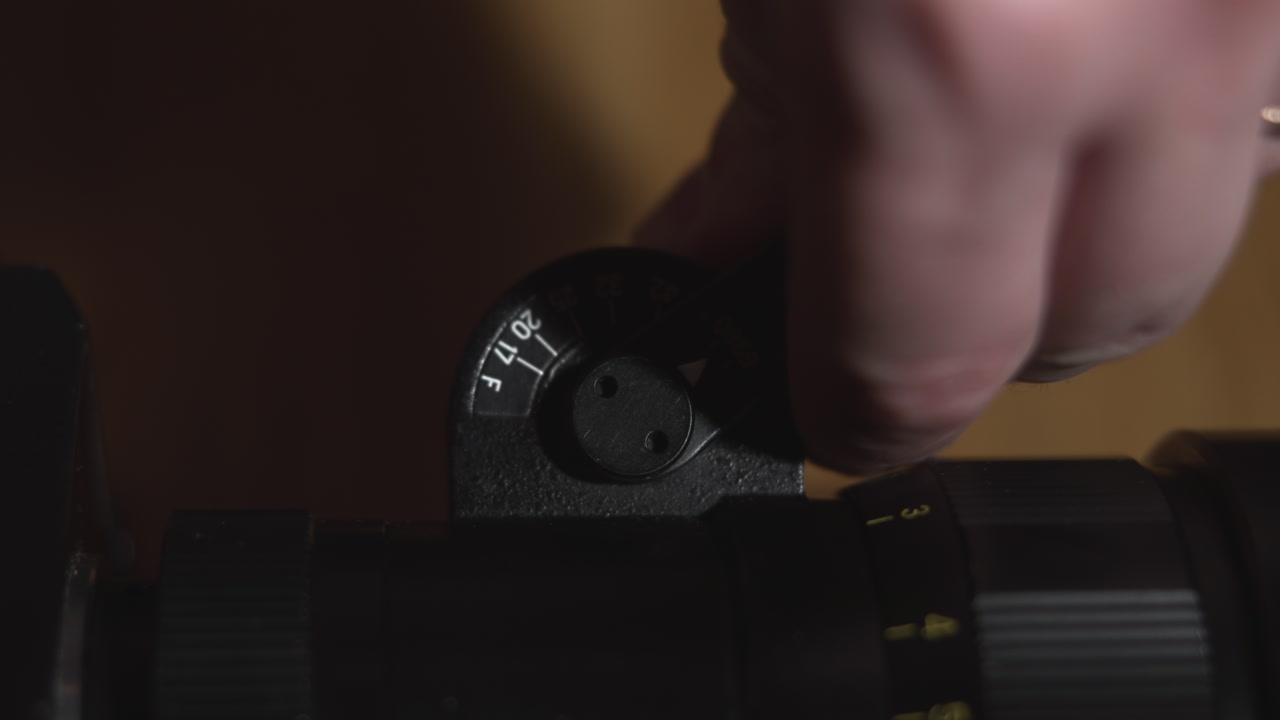 Closeup Fingers Turning Scope Elevation Dial For Accurate Sighting And Calibration On Tabletop With Numbered . Media
