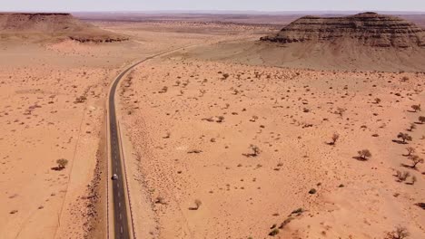 Adventure-Across-Endless-Dunes:-4K-drone-shot-of-Desert-Drive-in-Namibia,-Africa-with-Rooftop-Tented-4x4-Toyota-Hilux