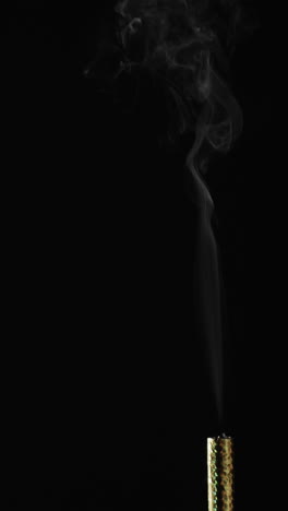 vertical video of lit torch and copy space on black background