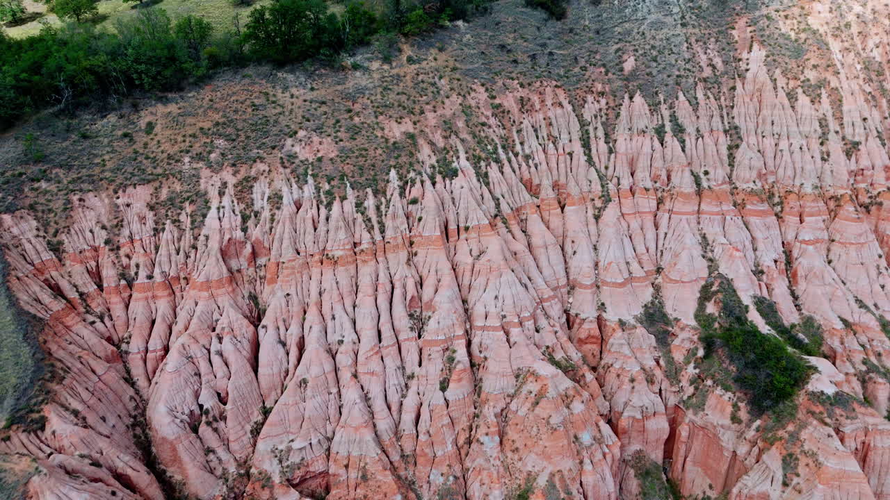 Drone view of Râpa Roșie cliffs, dramatic erosion, Romania nature