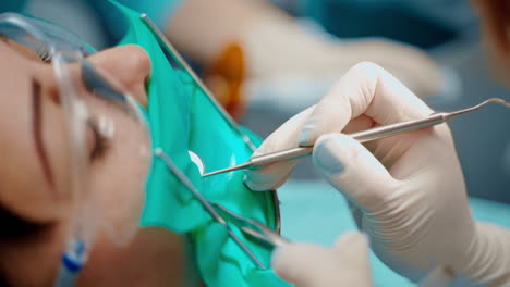 female patient at dentist. woman having dental treatment at dentist office