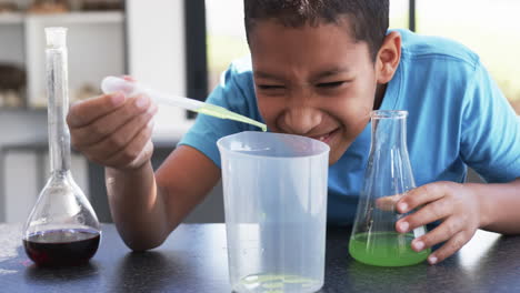 A-young-African-American-student-conducts-experiment-in-school-lab