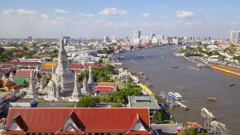 aerial view of wat arun temple and chao phraya river in bangkok, thailand