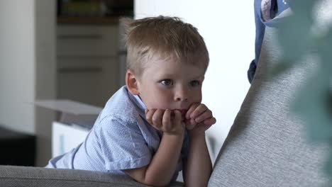 Restless-Thoughful-Young-Boy,-Rest-Arms-On-Sofa,-Static-Shot,-Medium