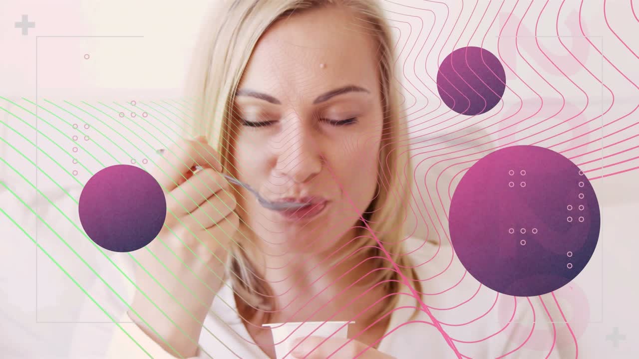 Animation of colorful abstract shapes over close up of caucasian woman eating yoghurt at home