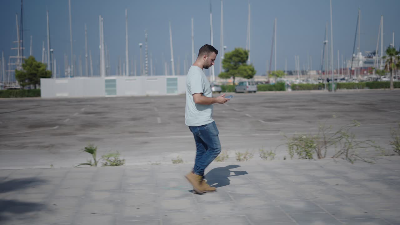 Man walking and using mobile devices