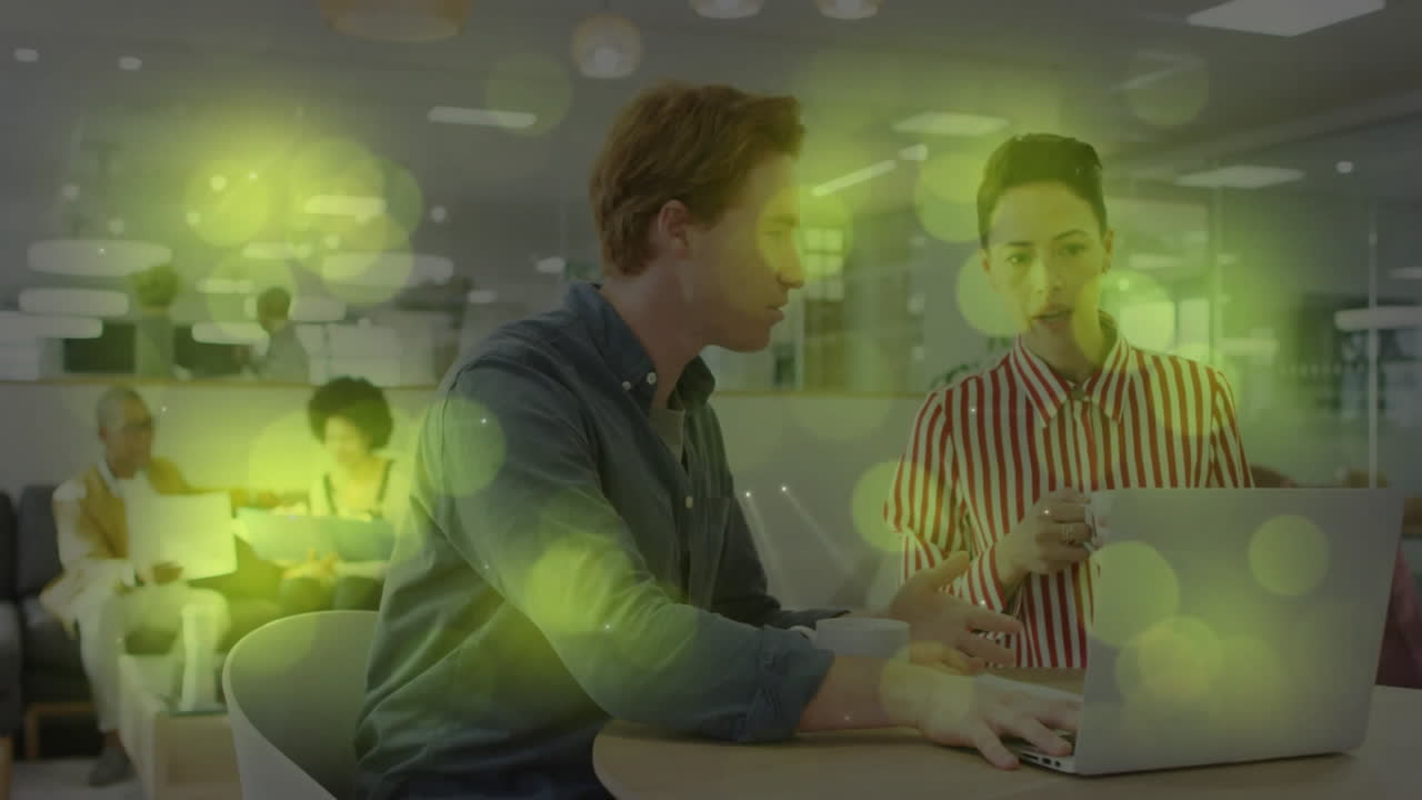 Business meeting in modern office with green light animation overlay