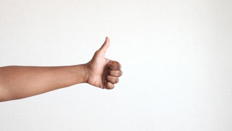 a hand giving a thumbs up gesture