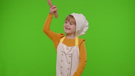 Child-girl-kid-dressed-as-cook-chef-taking-sausages-from-above,-fooling-around,-making-faces