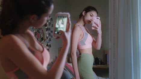 happy teenage girl taking selfie photo using smartphone posing in mirror sharing stylish fashion on social media enjoying weekend at home teen self image