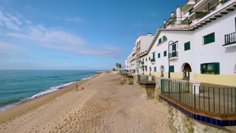 sant pol de mar promenade overlooking the mediterranean ocean maresme tourism beaches in barcelona sliding cinematic shoot