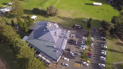 Top-down-bird-eye-flyover-a-car-park-in-the-children-playground