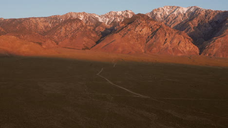 the snowy mountains of the sierra nevada during sunrise