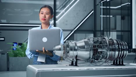 engineer examining jet engine design