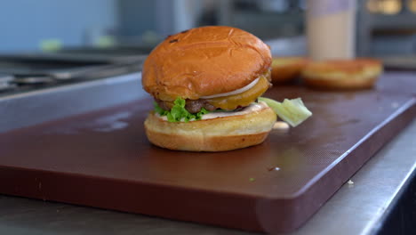 single cheeseburger sandwich on the table in the restaurant