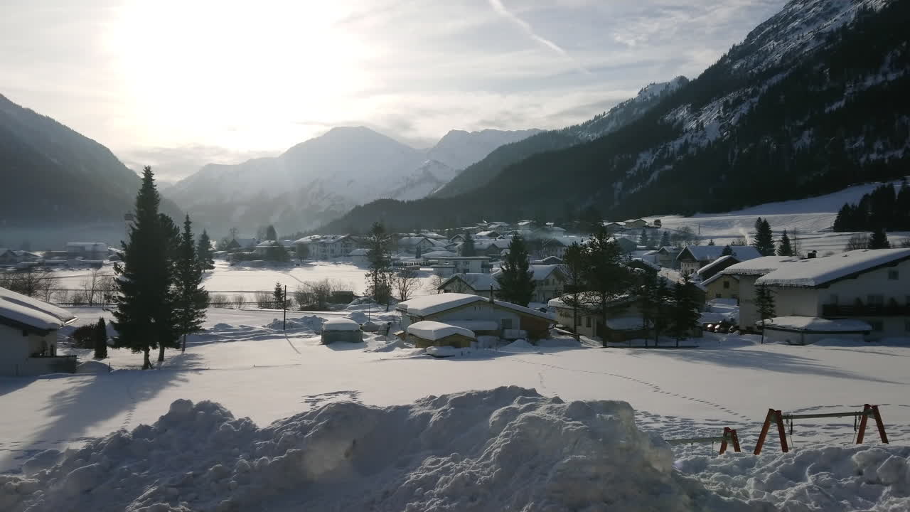 Landscape of alpine austrian village in winter with snow 4k footage ...