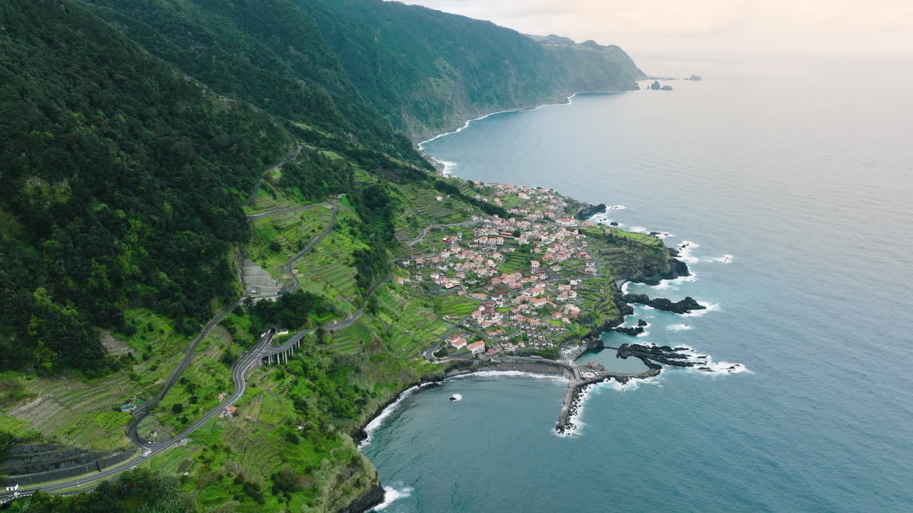 High elevation aerial view over scenic Seixal village on Madeira coastline