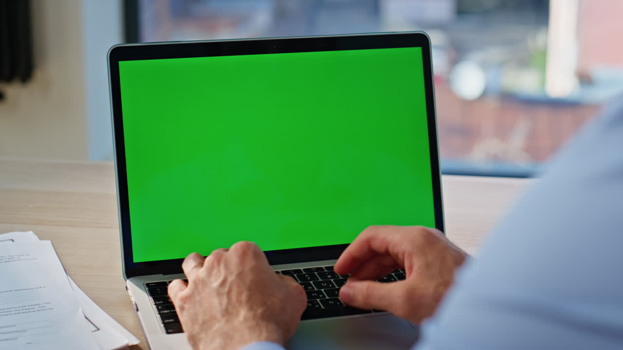 Worker typing email mockup laptop in corporate office closeup. Businessman hands