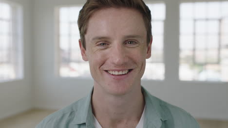 slow-motion-portrait-of-young-caucasian-man-smiling-happy-in-apartment-enjoying-successful-lifestyle-move-attractive-independent-male