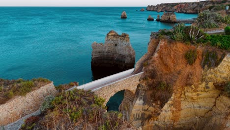 lush coastal cliffs and serene waters of portugal at sunset