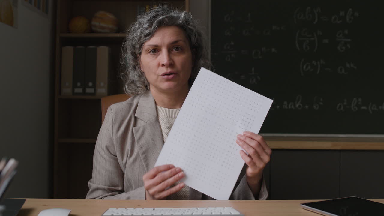 Teacher Reviewing a Test