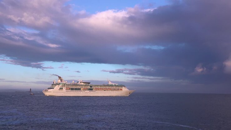A cruise ship sails across the open ocean