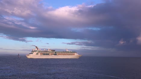 a cruise ship sails across the open ocean