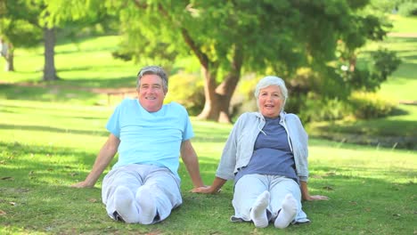 mature couple doing their stretches outside