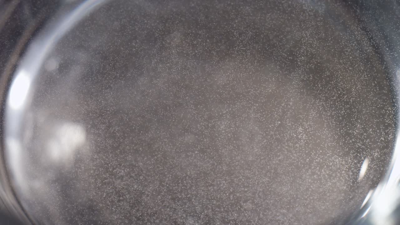 Macro white sparkles snow globe background texture