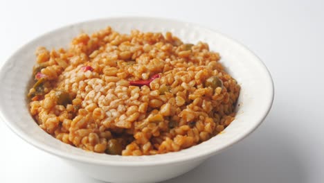 bulgur with vegetables in a white bowl