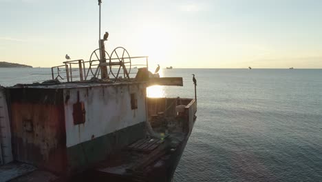 abandoned ship at sunrise/sunset