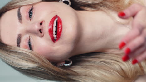woman with red lipstick and blonde hair