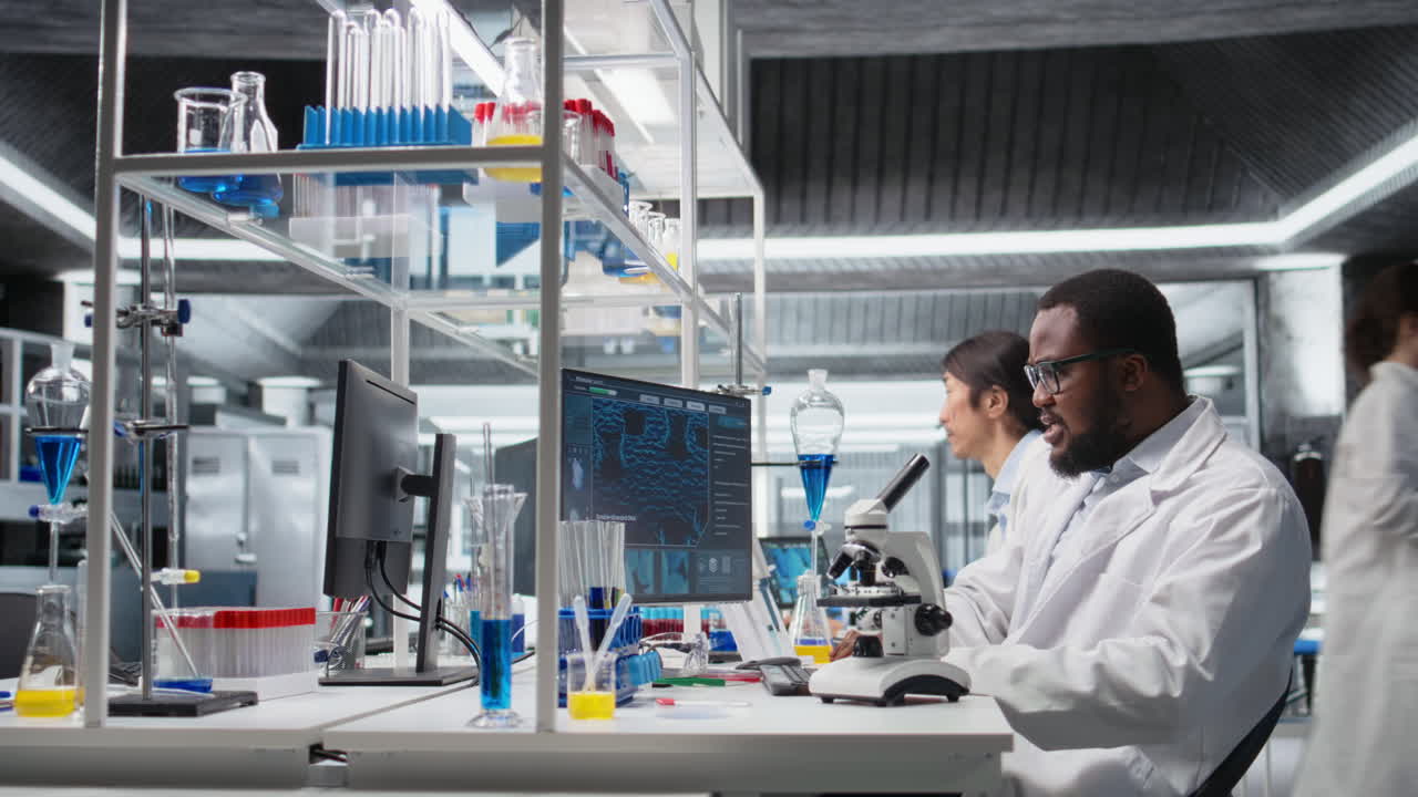 Vertical video Researcher using computer application to review patient data in laboratory