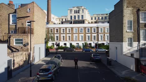 caucasian man flying drone in streets of london