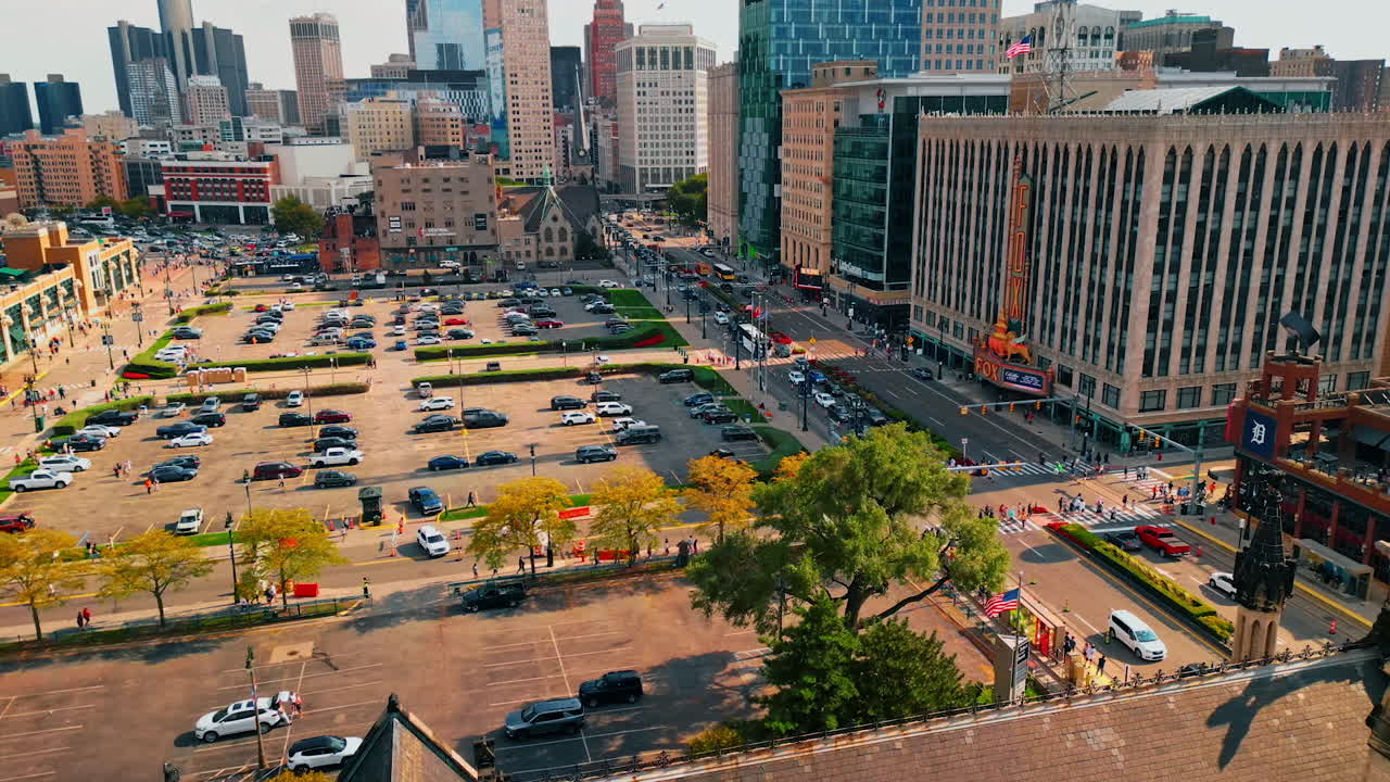 Detroit, USA, 28 July 2025: Approaching a large parking lot in front of the stadium. View on the roads with hectic traffic in Detroit, Michigan, USA. Downtown of modern city from aerial perspective