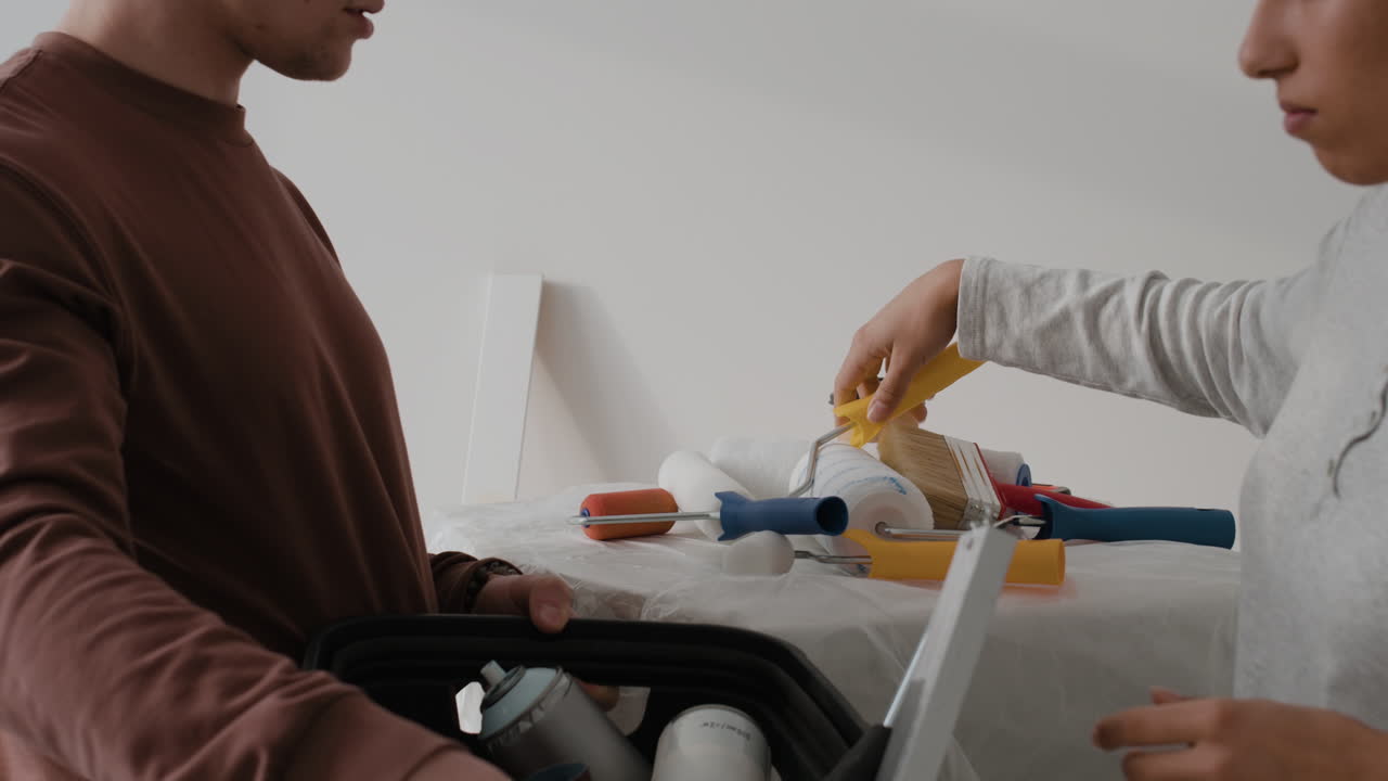 Young Couple Working Together on Home Improvement Project