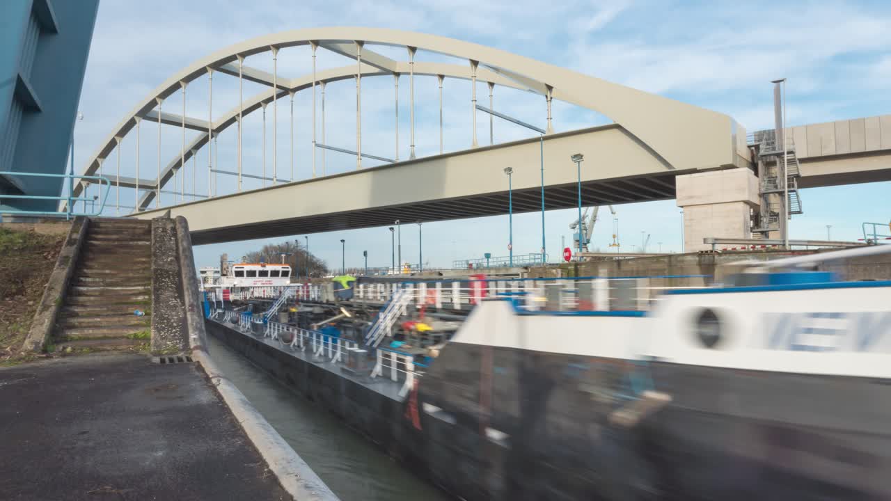 Time lapse of canal lock gates opening for shipping vessels