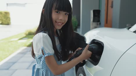 sustainable power source for progressive lifestyle shown by a girl hold ev plug