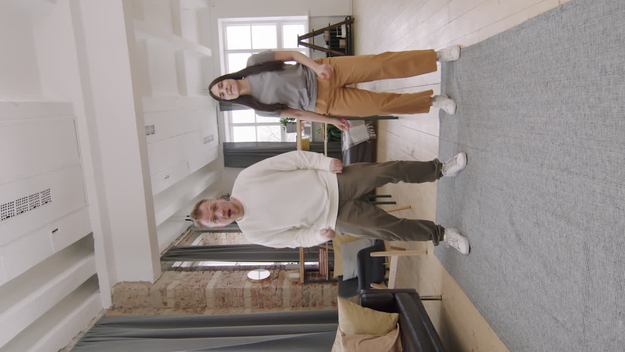 Vertical Shot of Happy Couple Dancing