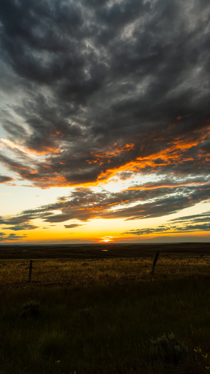 Color rich storm clouds forming under glowing sunset sky with textured layers and dramatic weather mood