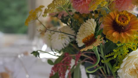 tables decorated for wedding dinner, defocus from one bouquet to another