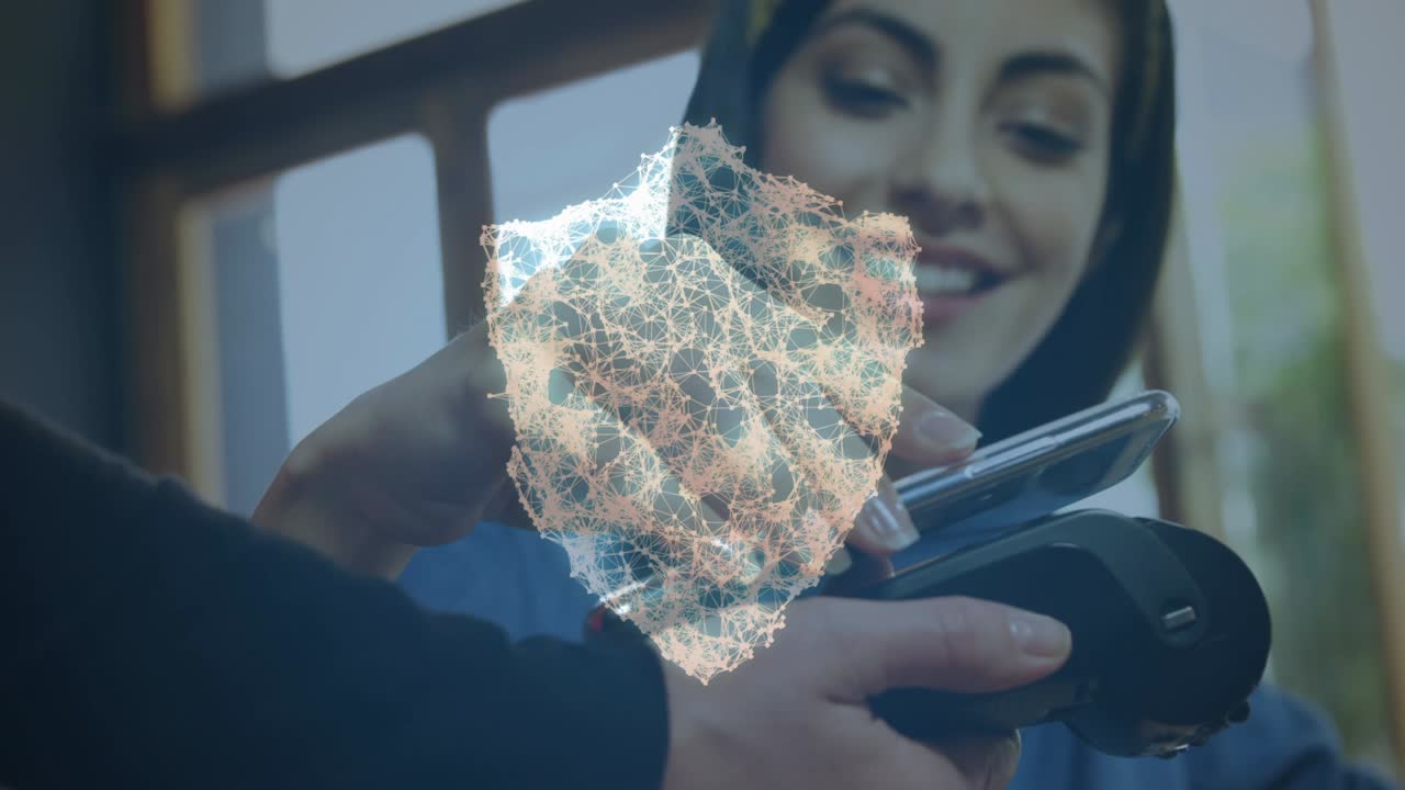 animación de la red de conexiones con escudo de seguridad sobre las personas que utilizan el terminal de pago