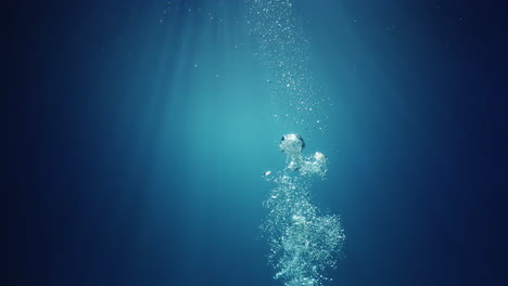 Unterwassersonnenstrahlen,-Die-Von-Oben-Scheinen,-Kommen-Durch-Das-Kristallklare-Blaue-Wasser-Und-Verursachen-Einen-Wunderschönen-Wasserbeleuchtungsreflexionsvorhang-Mit-Luftblasen,-Die-An-Die-Oberfläche-Steigen