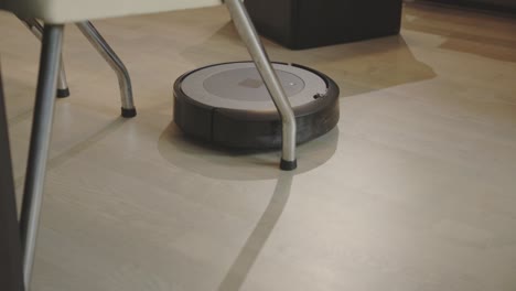 a robotic vacuum actively cleaning - close up